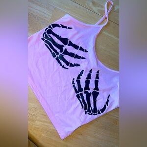 Size small fits like medium. Brand new as it’s too big for me. Light pink.